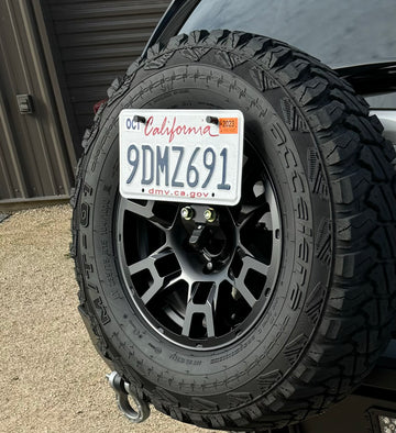 Spare tire license plate and camera mount.
